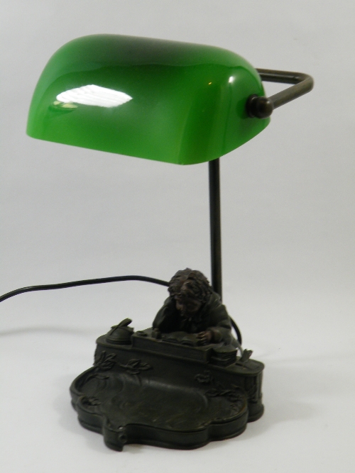 An Cold cast bronze banker`s desk lamp of child reading book at his study, green glass shade 37cm H