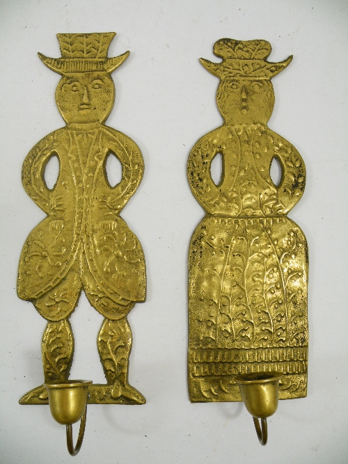 Pair of brass candle sconces, the back plates as cast 18th Century Dutch gingerbread figures 33cm,