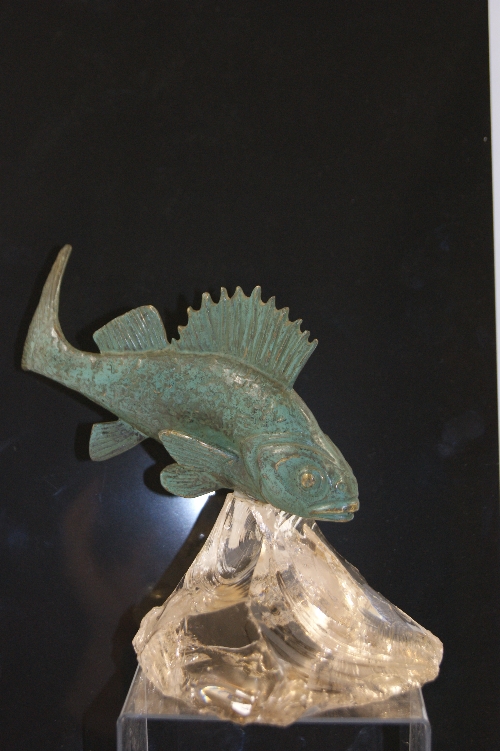 An unusual Art Deco French bronze study of a fish with verdigris patina and hewn clear glass base-