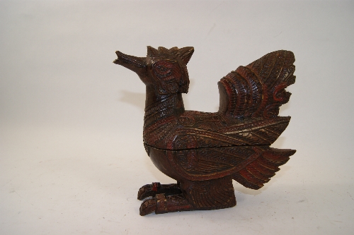 Balinese carved hardwood box modelled as a bird with painted and chip carved decoration 20cm high