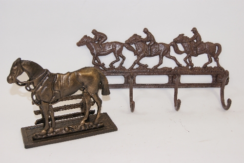 A cast metal coat rack modelled as a horse`s running together with a cast metal letter rack.