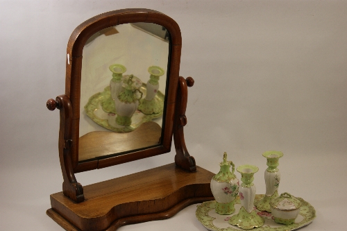 A Victorian mahogany dressing table mirror and Continental porcelain dressing table set on Art