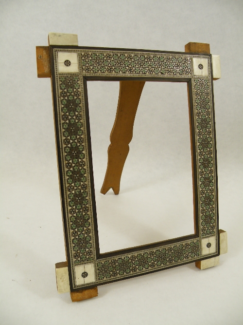 A 19th Century Indian ivory mounted and Sadeli work picture frame, having reticulated panels. Some