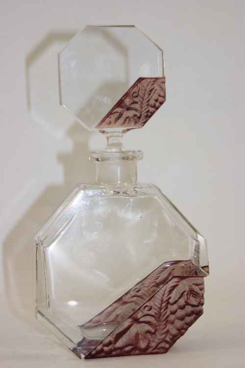 A large Bohemian Art Deco glass scent bottle with molded relief berry and leaf design with purple