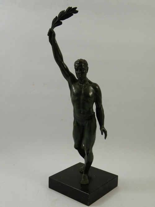 Art Deco spelter figure of male Olympiad figure holding laurel leaves of victory - in the style of