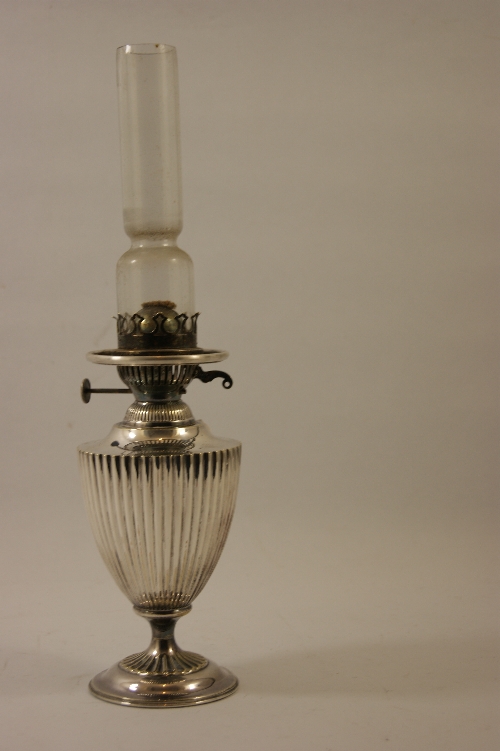 A good quality silver plated oil lamp of fluted Regency urn shape 39cm