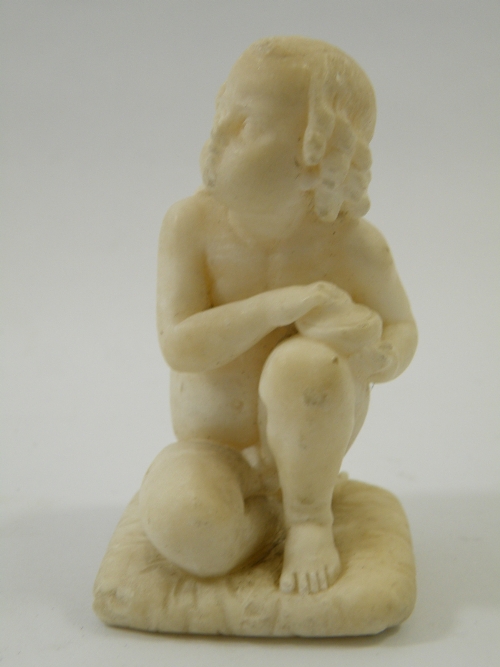 A 19th century finely carved Italian marble figure of a small boy holding a covered pot - carved