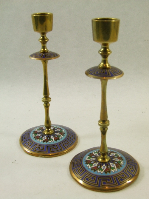 A pair of late 19th C Champleve enamel candlesticks 20cm high