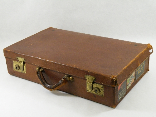 Vintage luggage: An early 20th C gents leather travel case with brass locks and assorted applied Art