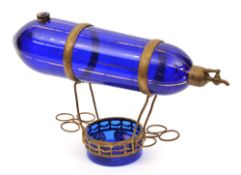 A fine French style glass liqueur decanter. In the shape of a dirigible, overall 36cm. Bright blue