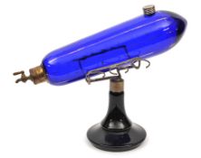 A fine French style glass liqueur decanter. In the shape of a dirigible, overall 36cm. Bright blue
