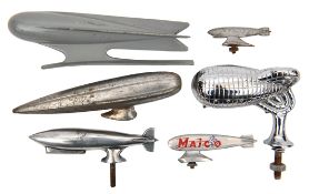 6 small airship/Zeppelin items. 5 car hood/bonnet ornaments- 2 very streamlined futuristic styled,