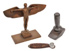 A bronze desk weight/ornament. In the form of Icarus with outstretched wings standing on a