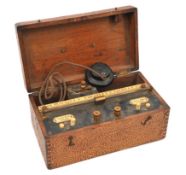 Heat damaged wooden box containing electrical measuring equipment. A wooden box (24cm x 13cm x