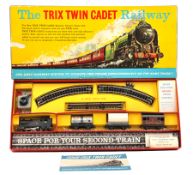 ‘The Trix Twin Cadet Railway’ set. A BR 0-4-0 tank locomotive in black plastic. Together with an