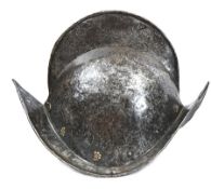 A late 16th century morion, formed in two halves, the low comb with turned over edge, the upturned
