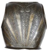 A late 16th century North Italian backplate, roped edges, deeply etched overall with radiating