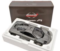 A limited issue Pauls Model Art 1:12 scale McLaren F1 Sports Car. Example in metallic gun metal