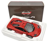 A limited issue Pauls Model Art 1:12 scale McLaren F1 Sports Car. Example in red with black