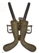 An unusual 19th century boot jack in the form of a double barrelled percussion pistol, of simple