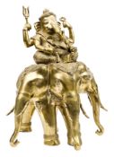 An impressive heavy cast gilt brass figure of the Indian elephant god Ganesh, height 17½”; the