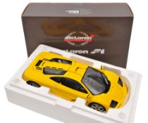 A limited issue Pauls Model Art 1:12 scale McLaren F1 Sports Car. Example in bright yellow with