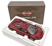 A limited issue Pauls Model Art 1:12 scale McLaren F1 Sports Car. Example in metallic burgundy