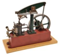 A Stuart beam engine Sturdy and well-made engine featuring a 18 cm flywheel and mounted on a 30 x