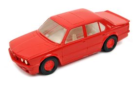 A Matchbox Superkings Series resin mock-up of a mid 1980’s BMW M5. In solid clear resin, painted