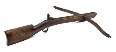 An 18th century German crossbow, 34” overall, the stout wooden stock with thick wrist and deep