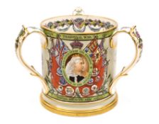A fine quality Boer War commemorative polychrome gilt loving cup, decorated in 3 panels separated by