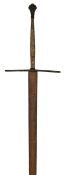 A good late 16th Century German 2 handed sword, the broad double edged blade 60” x 3”, deeply struck