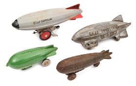 3 small cast iron American airship toys. The ‘Graf Zepplin’ (sic), unpainted, 21cm. ‘ZEP’ unpainted,