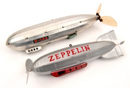 2 light alloy/tinplate clockwork airships. One Japanese by C.K. in silver light alloy 28cm ‘R.100’