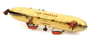 A Lehmann tinplate clockwork airship toy 767. 25cm. In anodised light cream finish with red and