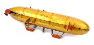 A Lehmann tinplate clockwork airship toy 652. 25cm. In anodised gold finish with red and black
