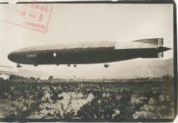 A file containing press cuttings and photographs relating to the ex-German Airship L72 ‘Dixmude’.