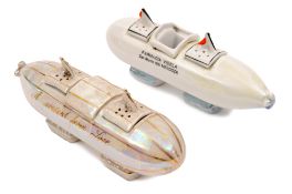 2 period china souvenir Zeppelin shaped cruet sets. Both approximately 19cm in length and both in