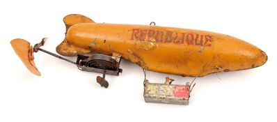 A rare early French tinplate clockwork airship toy. Based on the non-rigid airship ‘Republique’.