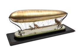 A silver-gilt commemorative model of the non-rigid airship ‘Clement Bayard II’. Hallmarked
