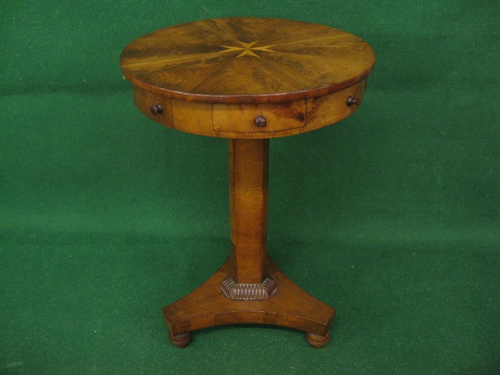 A William IV circular drum occasional table having three drawers supported by triangular column,