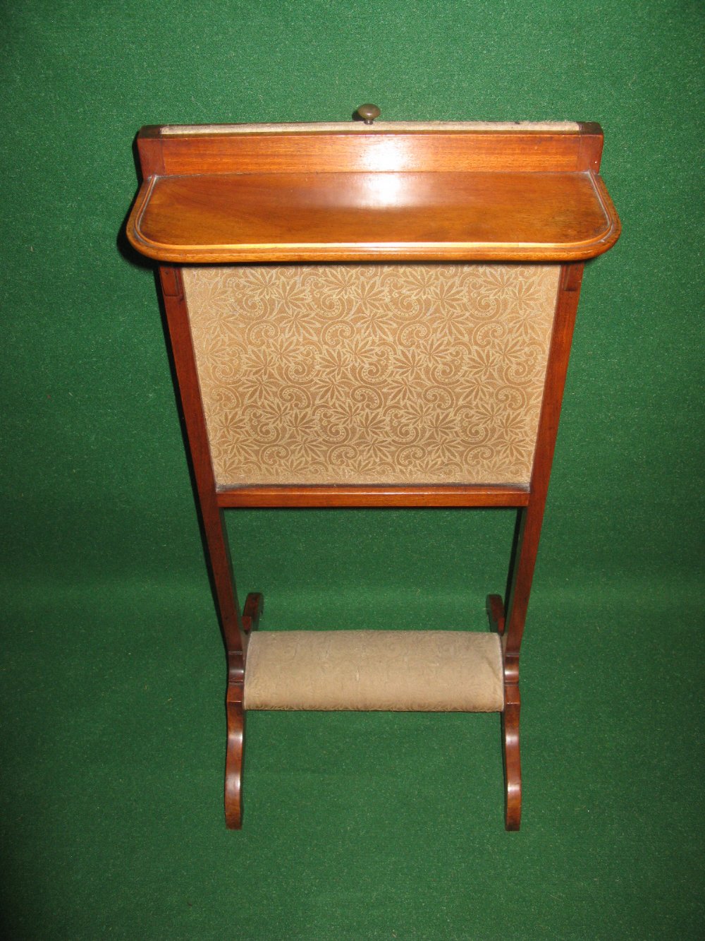 A satinwood adjustable screen with upholstered kneeling rest and fixed shelf