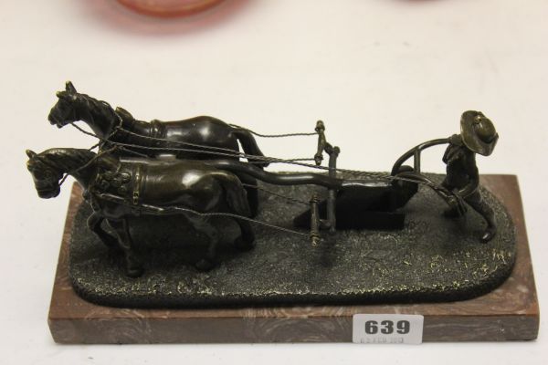 A Bronze Figure of Horses Ploughing