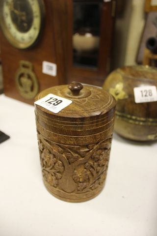 A Heavily Carved Wooden Circular Box with Lid