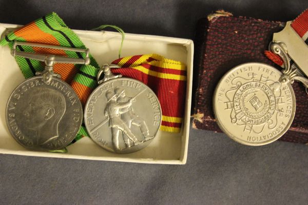 A British Fire Service 20 Year Medal and Ribbon and a For Exemplary Fire Service Medal (both awarded