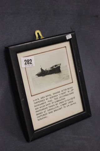 A Framed and Glazed Photograph and Description of HMS Ark Royal Sinking