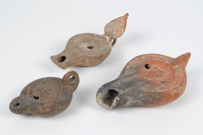 circa 200-300AD: Roman terracotta oil lamps A selection of three interesting Roman lamps. Of various