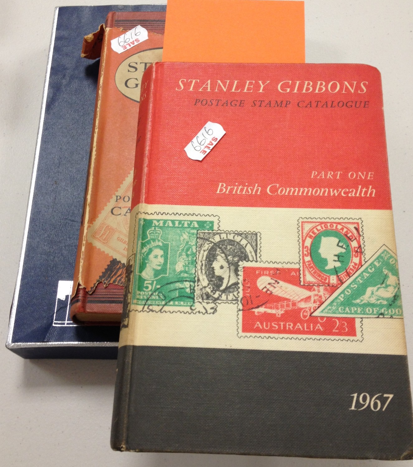 Two Stanley Gibbons Catalogues and Box of Stamps