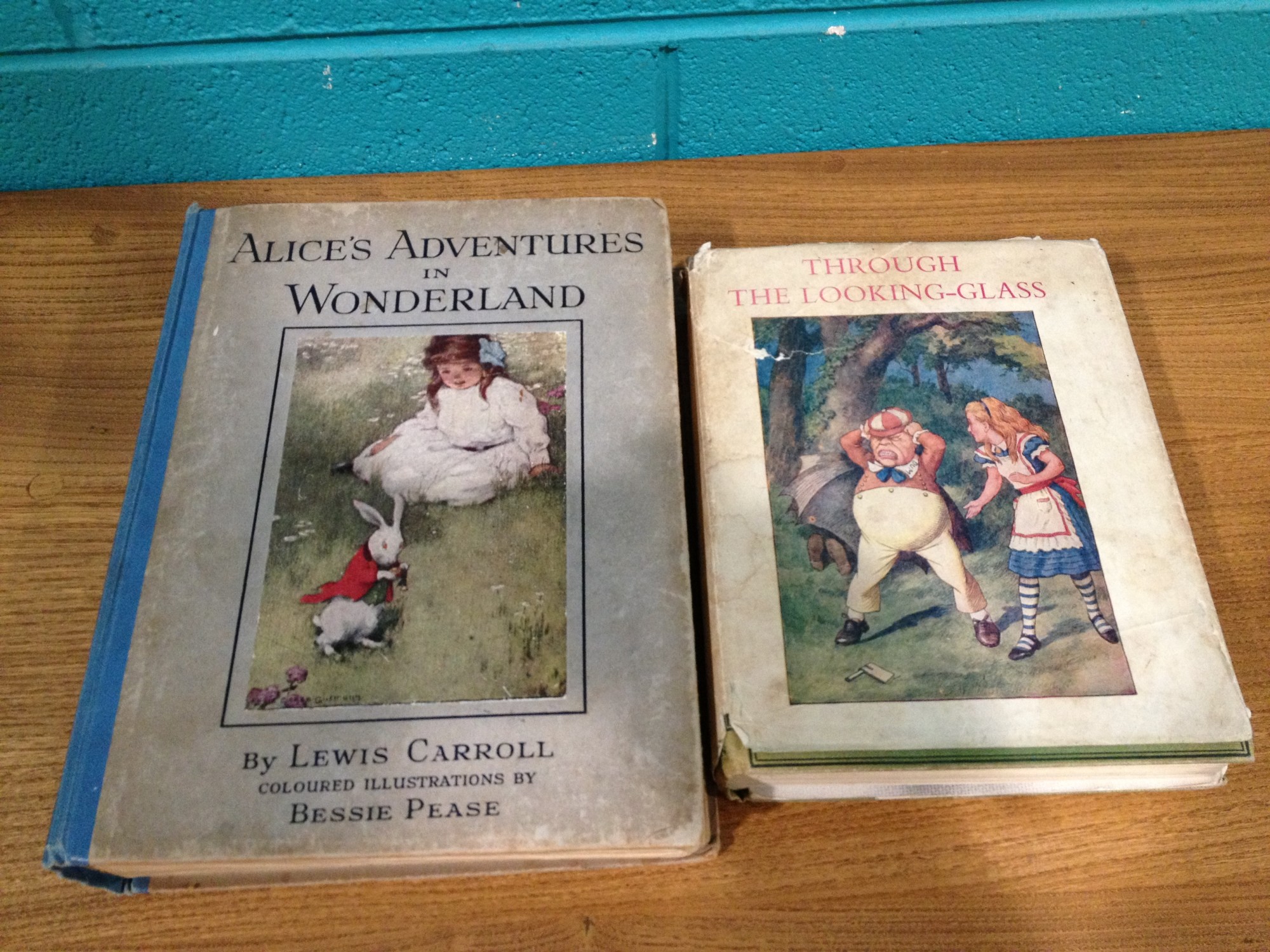 Two illustrated Alice in wonderland books