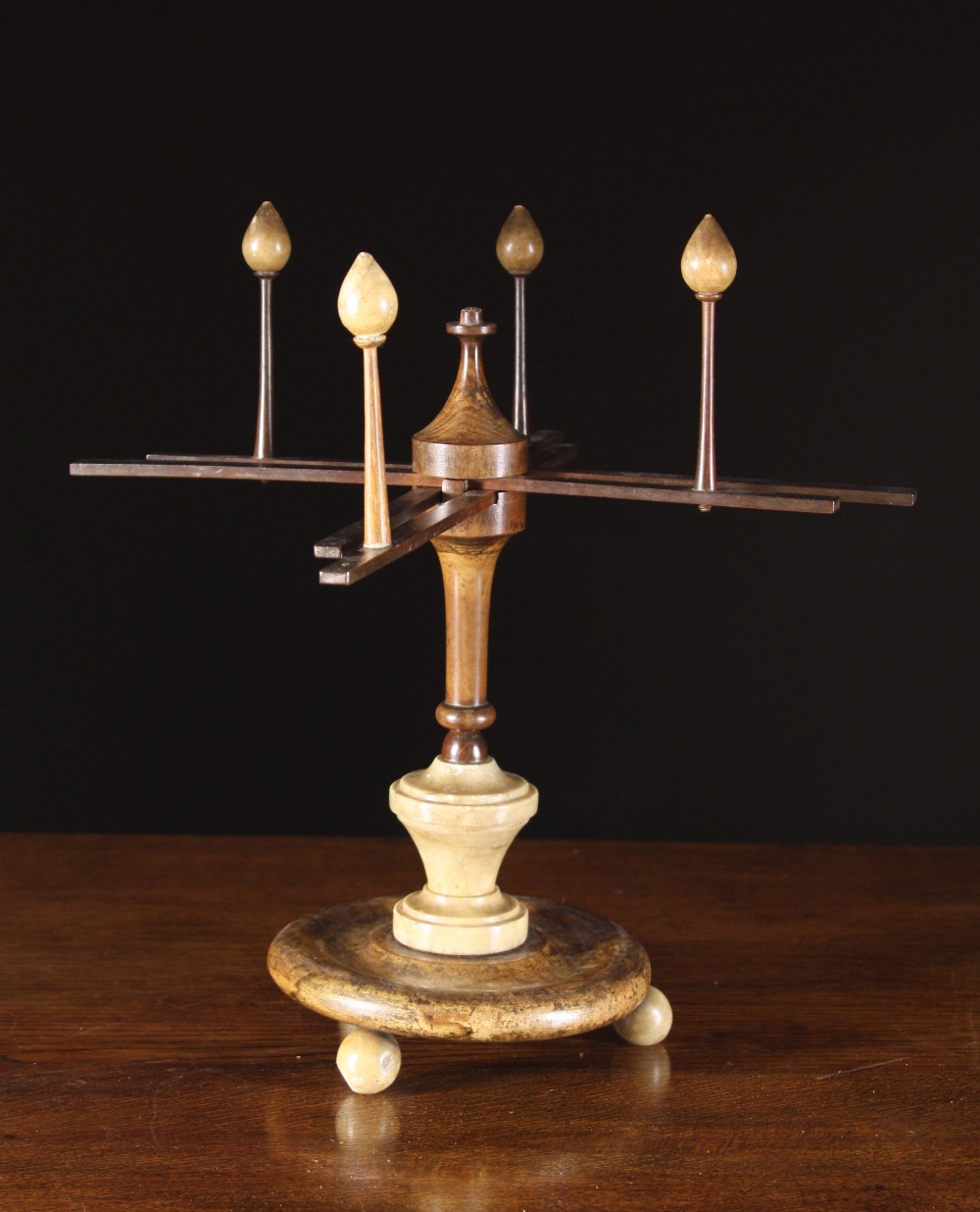 An Unusual 19th Century Wool Winder with turned alabaster finials, stem section and ball feet, 14